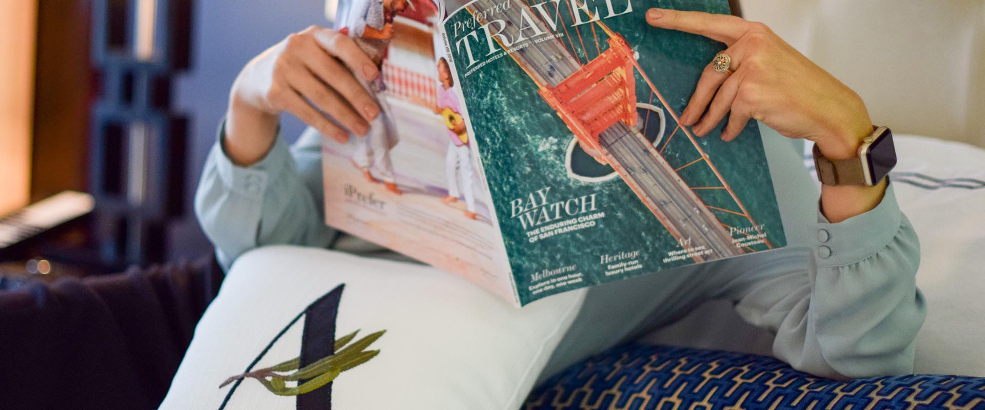 Hotel guest reading a magazine