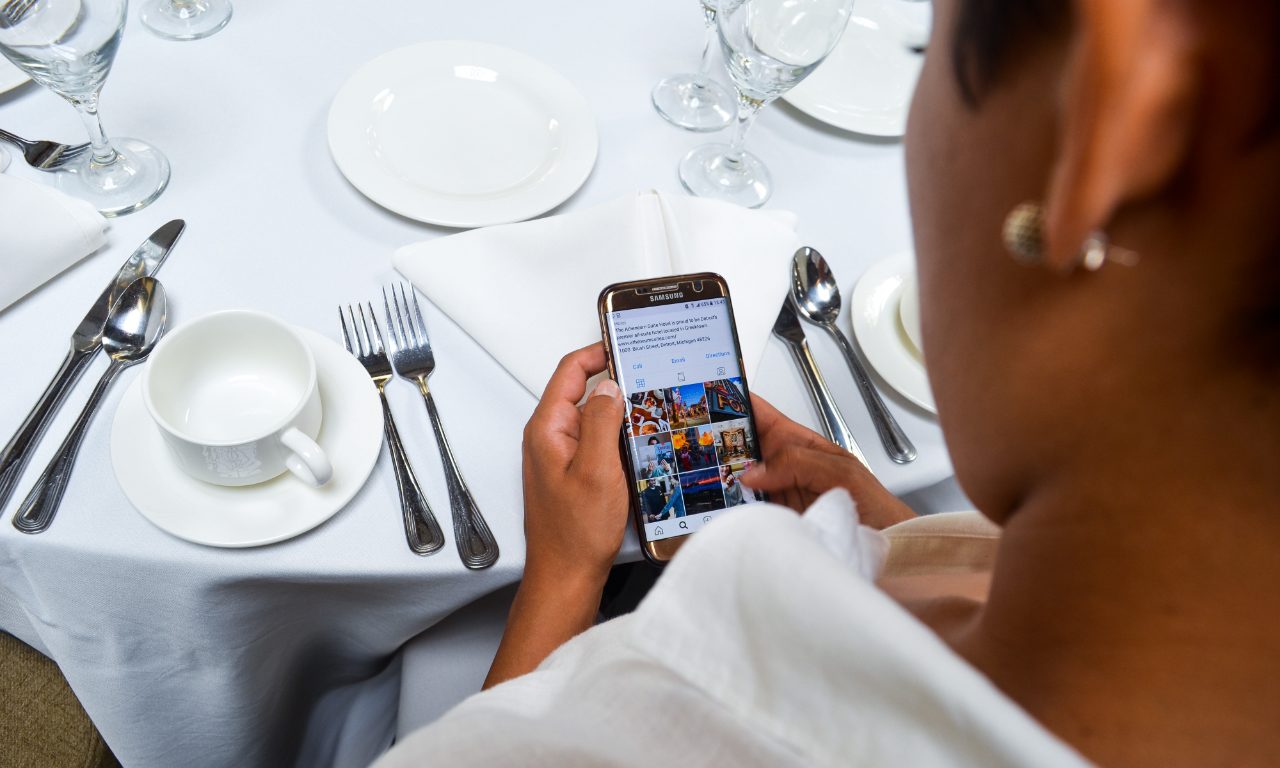 Person on phone at banquet table